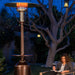 relaxing by the patio comfort pc02cab vintage propane patio heater with a book and a glass of wine