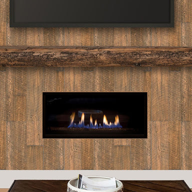 Pearl Mantels Honey Roast Non-Combustible Wall Boards installed in a fireplace area with a wood mantel