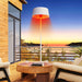 paragon outdoor sol freestanding electric heater on a terrace with lake view