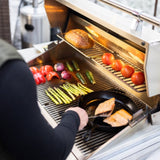 grilling salmon and vegetables on the American Made Grills Atlas 36 Built-In Gas Grill