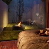 EcoSmart Fire Ark 39-Inch Round Concrete Black Fire Pit Table in an outdoor space