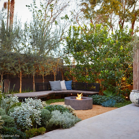 EcoSmart Fire Ark 39-Inch Round Concrete Gray Fire Pit Table in a patio