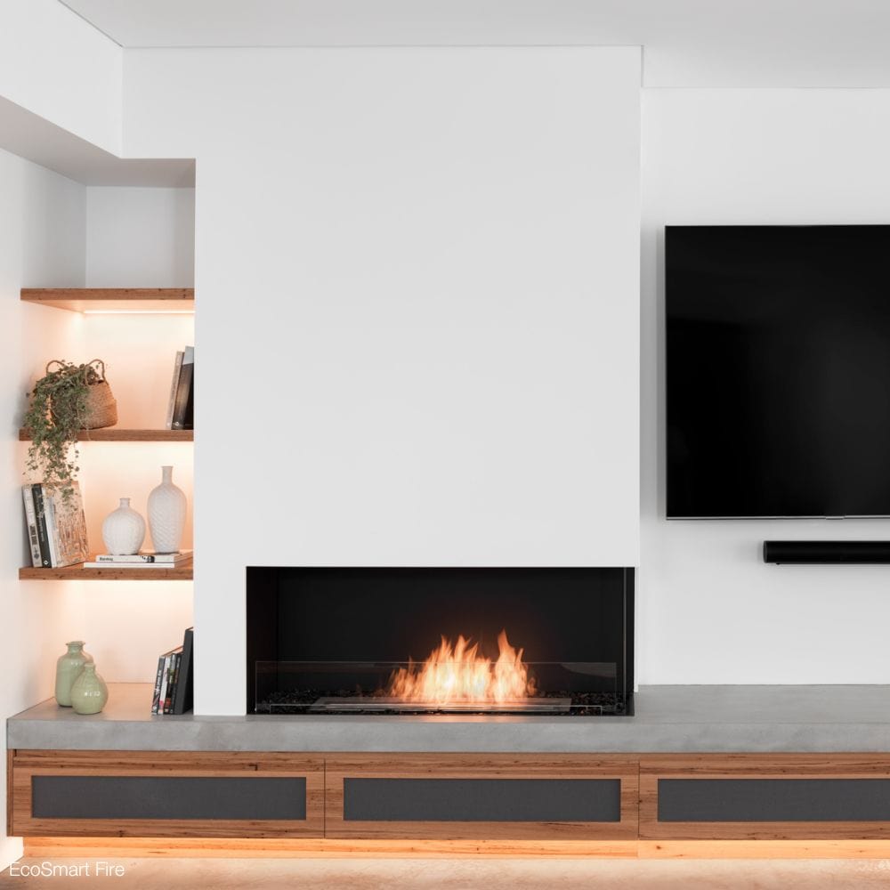 EcoSmart Fire Flex Ethanol Firebox with One Open Side installed beside a shelf