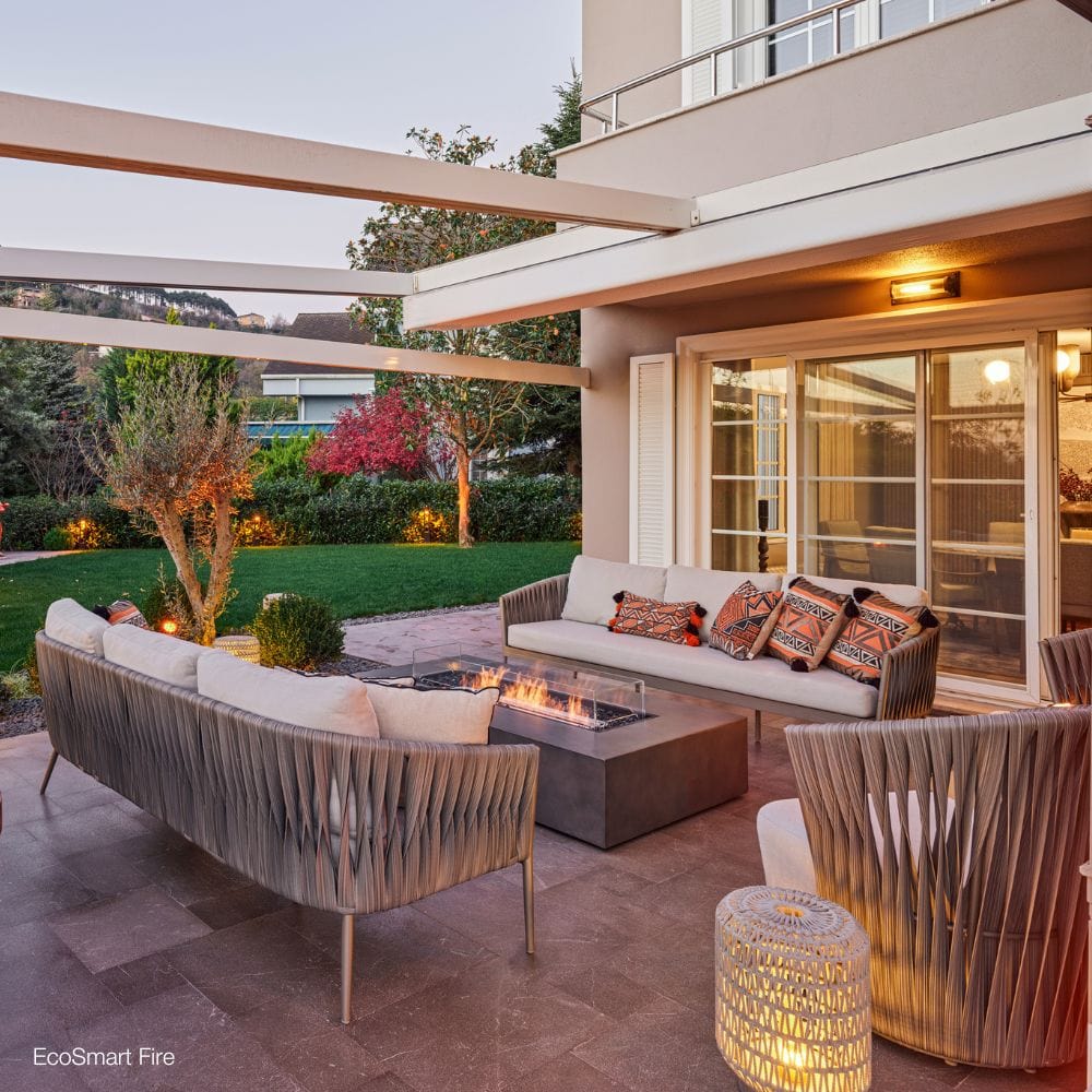 ecosmart fire wharf ethanol fire pit table in a garden