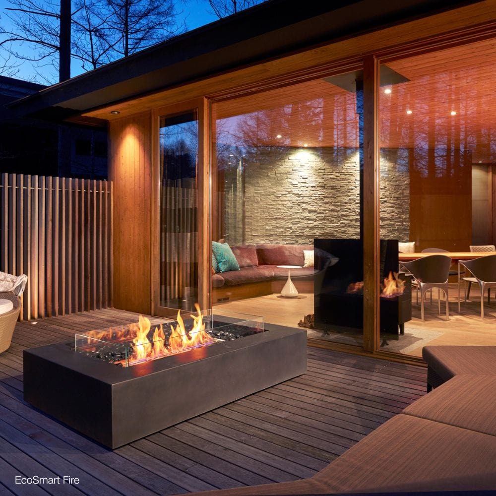 ecosmart fire wharf gray ethanol fire pit table in a patio in a patio