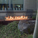 Fire Garden 108-Inch Linear Powder-Coated Steel Natural Gas Fire Pit in an outdoor space