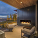 Fire Garden Linear Vent-Free Outdoor Natural Gas Fireplace on a patio by the garden