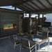 Fire Garden Linear See-Through Outdoor Natural Gas Fireplace in a patio dining area