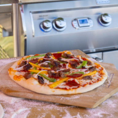 Homemade Pizza on wooden pizza peel