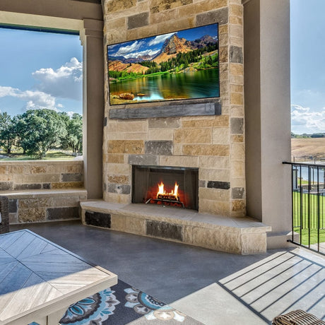 Lexington Hearth Hayloft Beam Gray Faux Wood Mantel on a stone wall