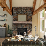 Lexington Hearth Rickhouse Concrete Faux Wood Mantel Shelf on a stone wall