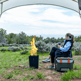 Enjoy the Live Outdoor Firestorm Series I Fire Pit with the Burner On at an Outside Campsite Amidst Beautiful Scenery