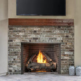 majestic courtyard fireplace with brick interiors and a beautiful wood mantel