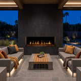 Modern Flames Orion Multi V2 built into a stone wall on a covered outdoor patio