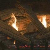 close up on yellow flames and driftwood logs