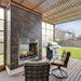 Montigo Divine See-Through Outdoor Gas Fireplace on a deck under a pergola