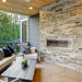 Montigo Mahana PL60VO Outdoor Fireplace built into a brick wall