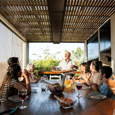 Enjoying lunch on a patio with the PhantomSchwank Wall/Ceiling-Mounted Gas Patio Heater
