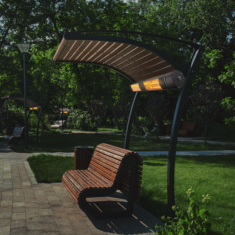 RADtec Genesis 38-Inch Infrared Electric Heater mounted above the bench in a park