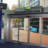 Schwank Breeze8 Wall-Mounted Air Curtain With Heat above an entrance