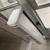 schwank breeze8 air curtain mounted on a beam