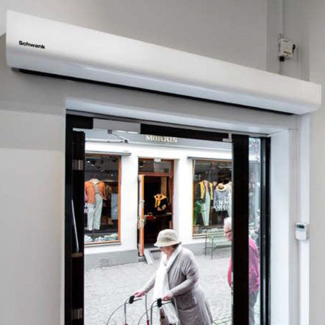Schwank Select10 Wall-Mounted Air Curtain With Heat above a door