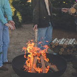 burning firewood on the seasons fire pits elliptical steel fire pit