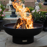 seasons fire pits elliptical steel fire pit near a fountain