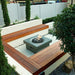 Solus Elevated Halo 36-Inch Square Gas Fire Pit in a cozy patio setting