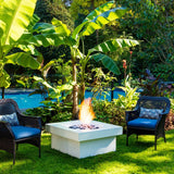 solus elevated halo square gas fire pit near some banana trees