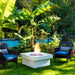 solus elevated halo square gas fire pit near some banana trees