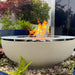 solus luna 42 gas fire pit in a lush outdoor space