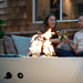 enjoying a glass of wine by the solus luna 42 gas fire pit