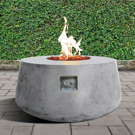 Stonelum Indiana 01 47-Inch Round White Gas Fire Pit in a garden