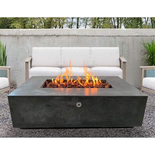 Stonelum Manhattan 01 Rectangular Graphite Fire Pit Table in a backyard