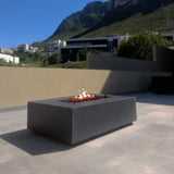 Stonelum Manhattan 01 Rectangular Graphite Fire Pit Table in a patio
