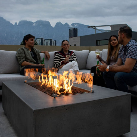 Gathering around the Stonelum Manhattan 01 Rectangular Graphite Fire Pit Table