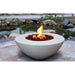 Stonelum Venecia 03 42-Inch Round White Fire Bowl by a pond