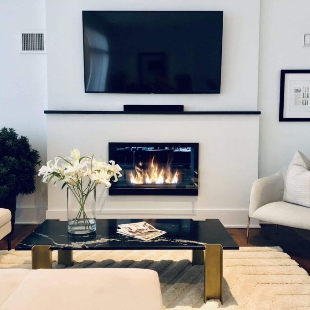 The Bio Flame 38-Inch Firebox Black Ethanol Fireplace in a living room