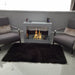 The Bio Flame Rogue 2.0  2 sided ethanol fireplace between 2 sofas