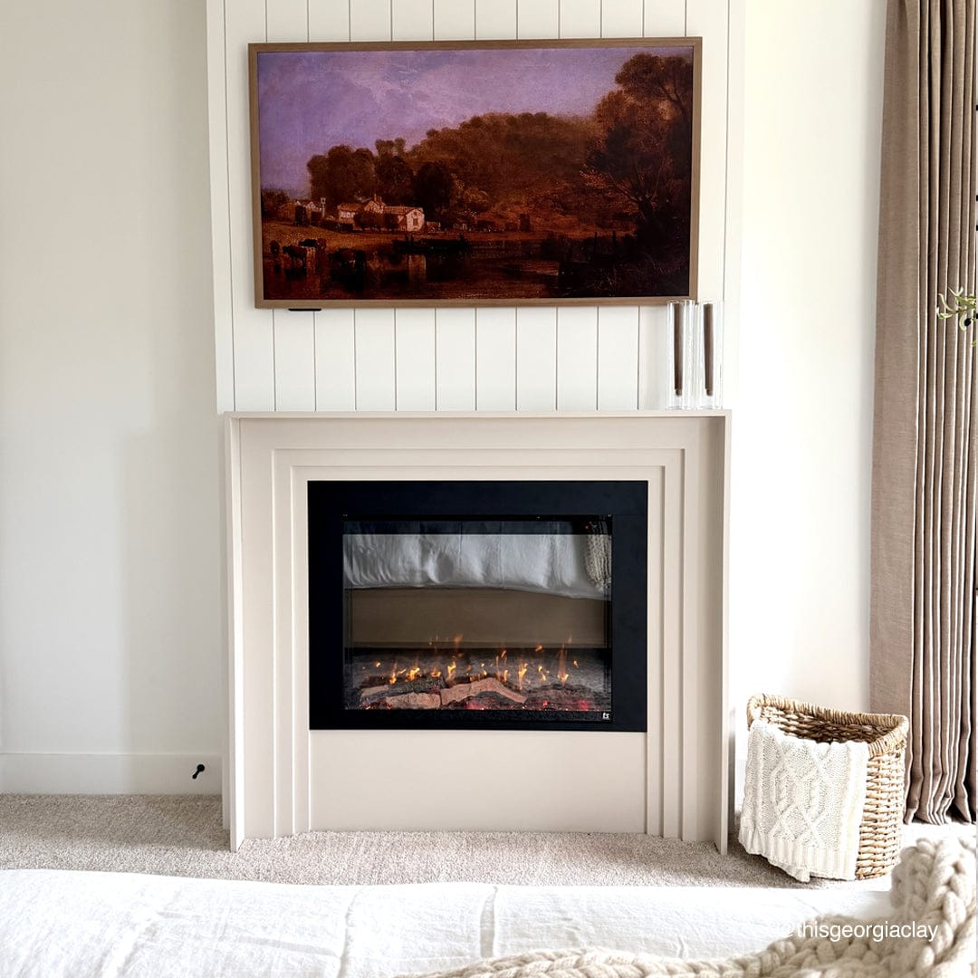 Touchstone Fireplug PRO electric fireplace insert front view in a bedroom