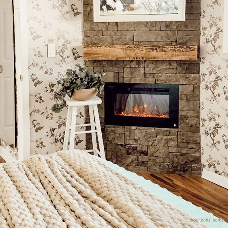 Touchstone Sideline 28-Inch recessed electric fireplace installed in a room