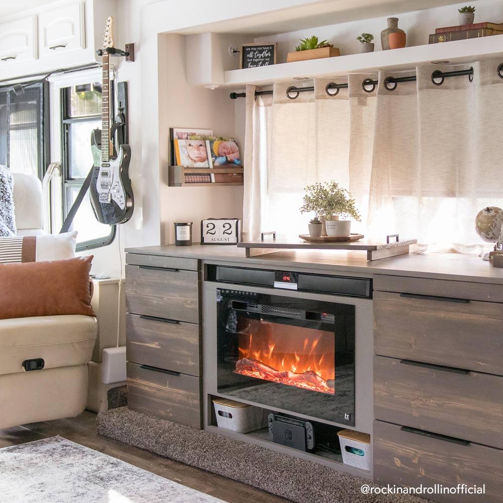 Touchstone Sideline 28-Inch recessed electric fireplace installed in a room