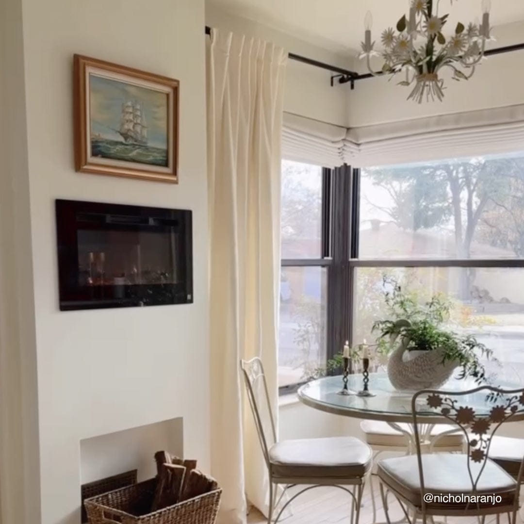 Touchstone Sideline 28-Inch recessed electric fireplace installed in a room