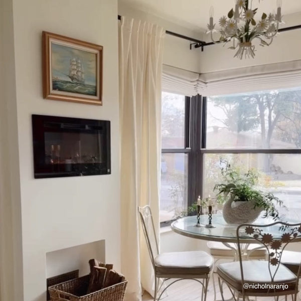 Touchstone Sideline 28-Inch recessed electric fireplace installed in a room
