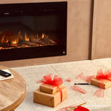 Touchstone Sideline 45 electric fireplace behind a table with wrapped gifts