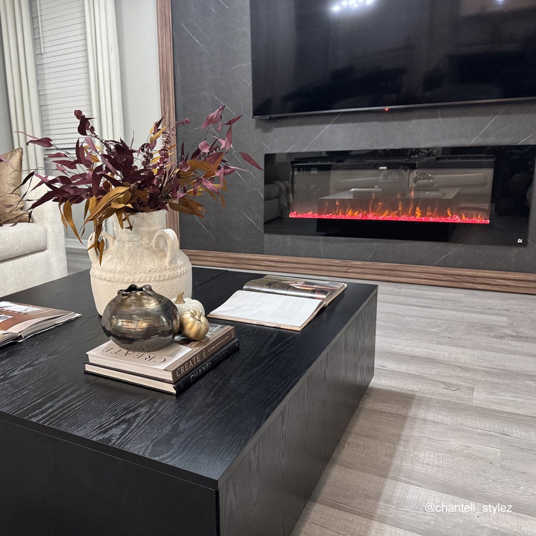 Touchstone Sideline 60 electric fireplace behind a coffee table in a styled living room
