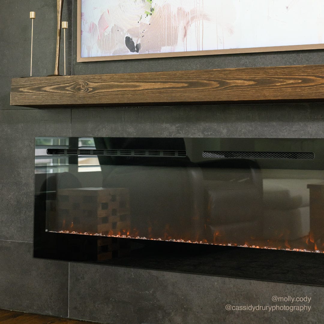 Touchstone Sideline 84-Inch recessed electric fireplace installed in a room