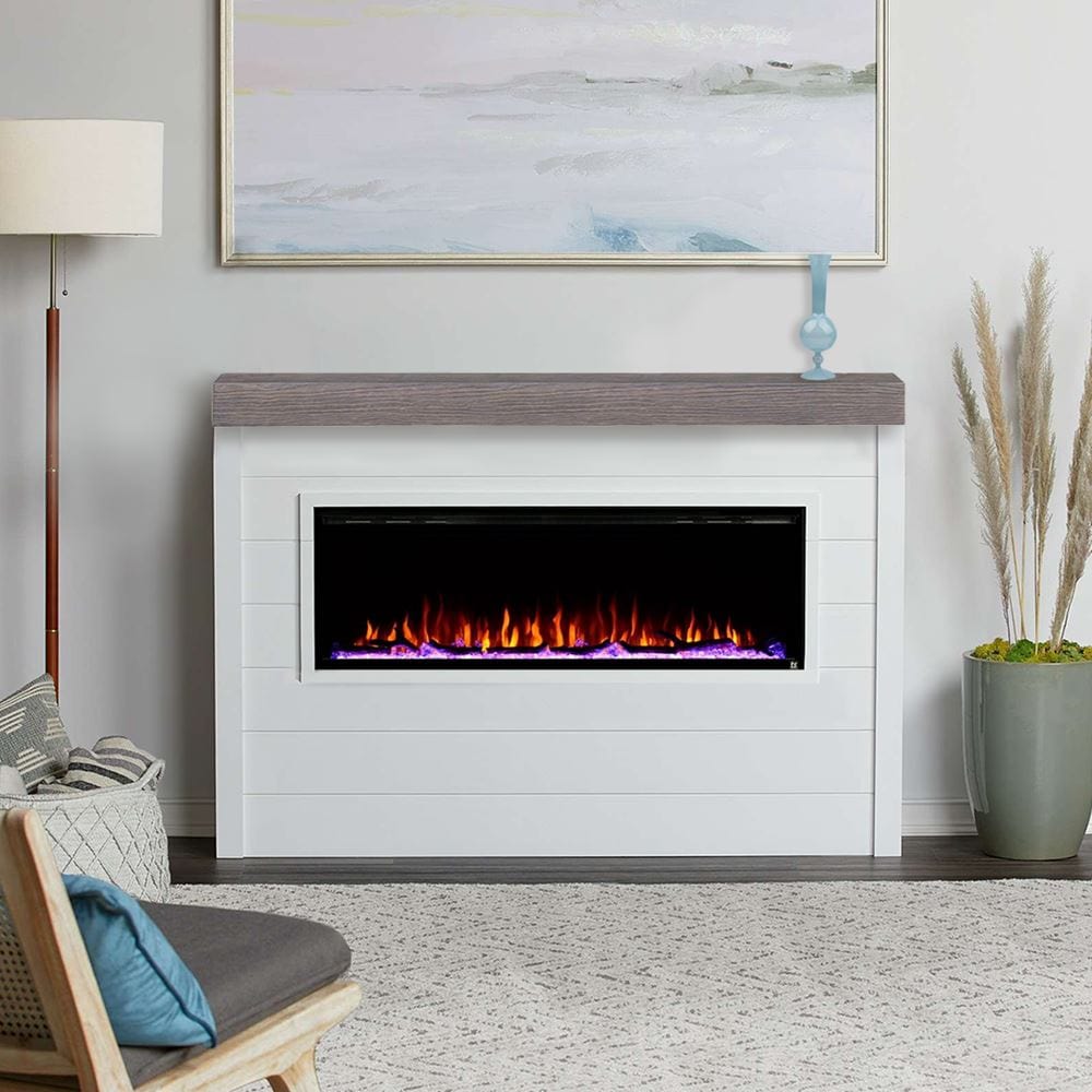 Touchstone Sideline Elite 60 Electric Fireplace with brown faux wood mantel on shiplap wall