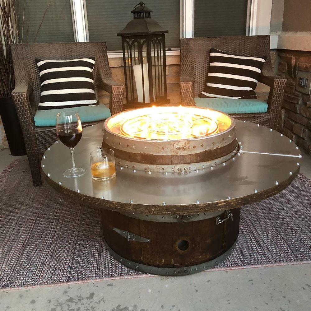 glass of wine on wine barrel dude coffee table wooden gas fire pit table